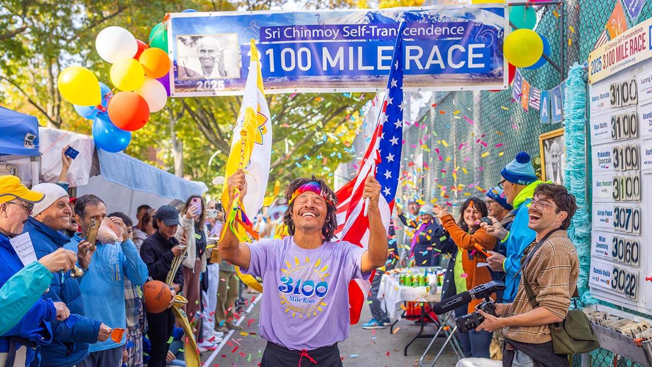 Alex Ramsey crossing the finish line at the 3100 Mile Race 2025